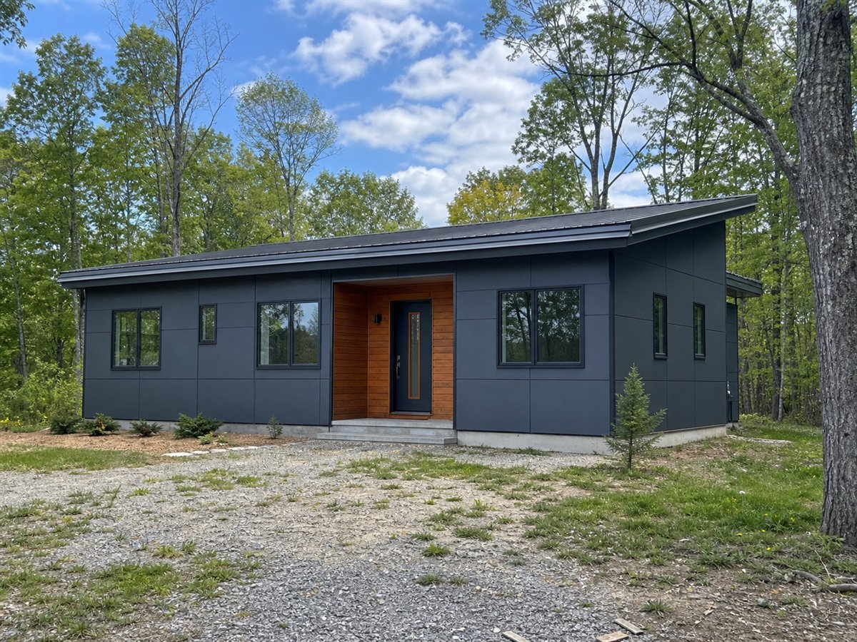 Slate Ridge Modern 1710, a conceptual 1710-square-foot shed-roof contemporary family home with a $305,000 construction target