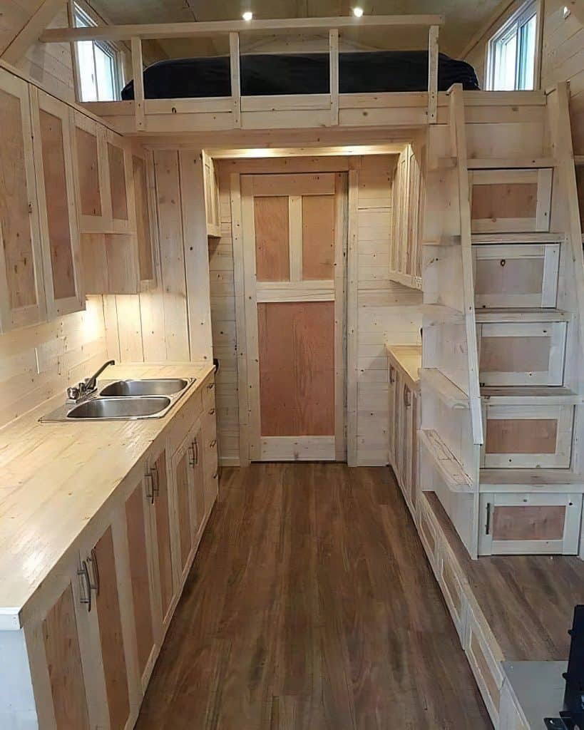 Compact wood galley kitchen with tall pantry storage