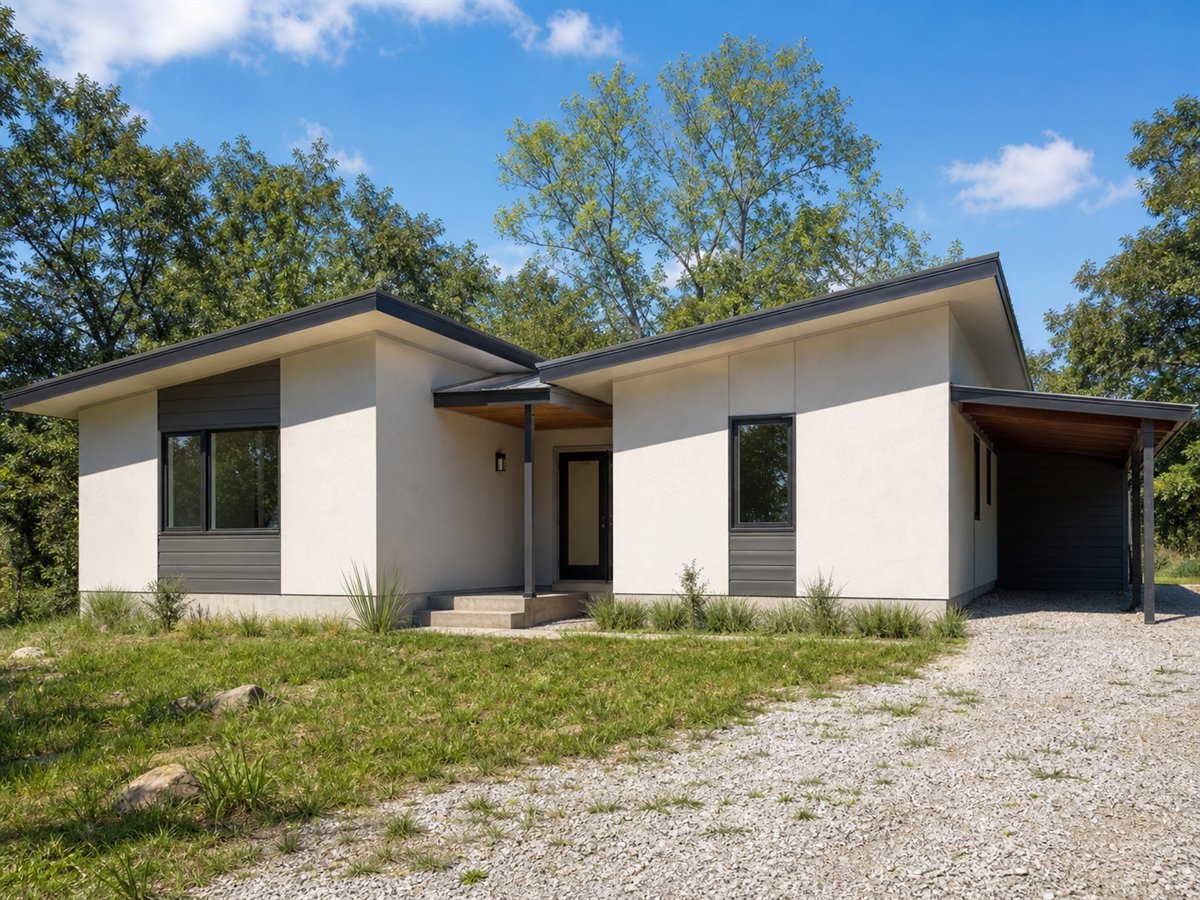 Butterfly Nook 891, a conceptual 891-square-foot restrained butterfly-roof cottage with a $138,625 construction target