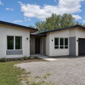 $188,625 Comfortable Restrained Butterfly-Roof Cottage: 1,133-Sq.-Ft. Two-Bedroom Plan