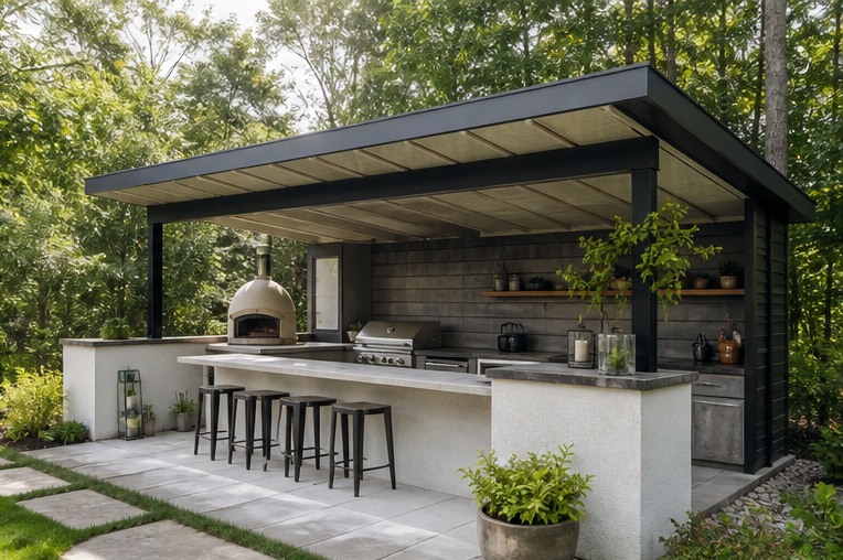 Covered outdoor kitchen with deep roof and wood serving ledge
