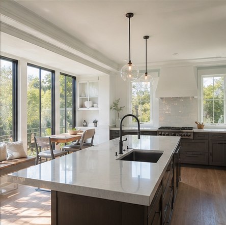 Bright kitchen with large windows and discreet pendant lights