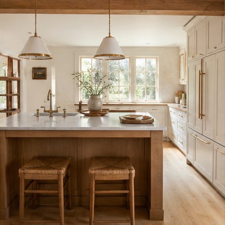 Cream farmhouse kitchen with handmade tile and oak island