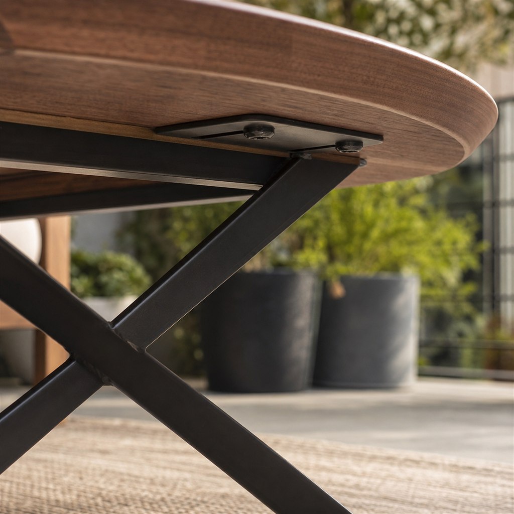 Oval Coffee Table With a Walnut Top and Crossed Steel Legs - wood-to-steel interface detail