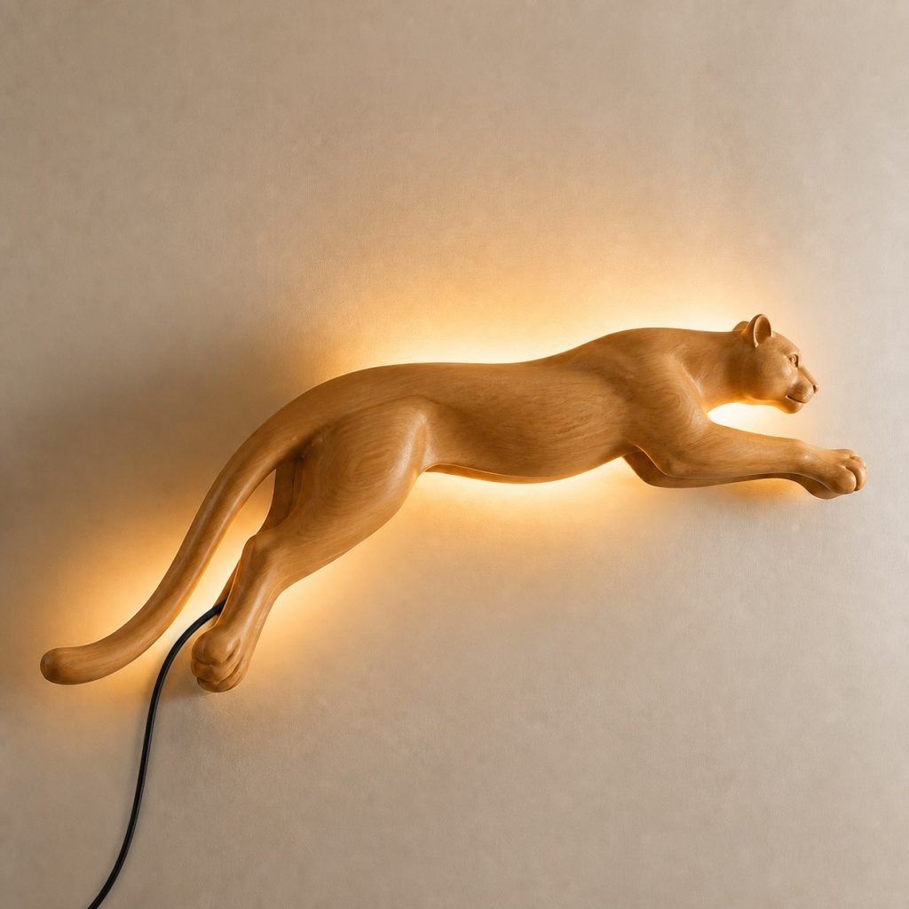 Leaping Cougar Wall Sconce shown as an original square photorealistic cougar lamp made from natural light-yellow wood with fine grain and warm diffused light